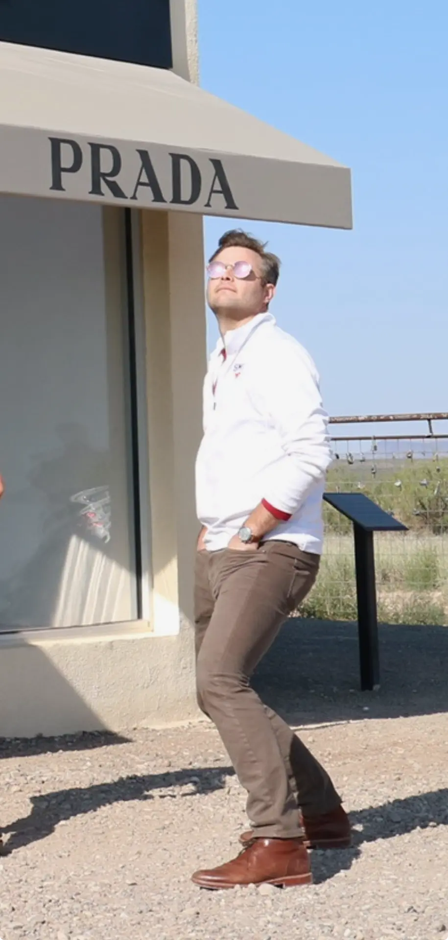 Clark posing in pink sunglasses
